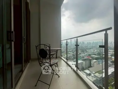 Stunning high-rise balcony with panoramic city view, perfect for relaxation and enjoying the skyline.