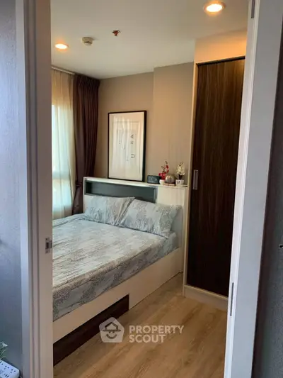 Cozy bedroom with modern decor and ample natural light