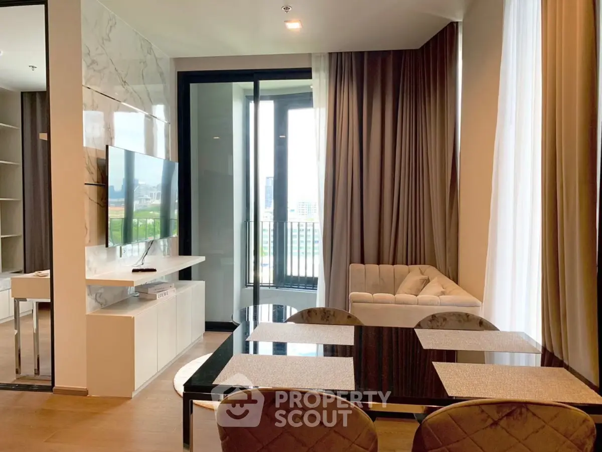 Modern living room with elegant decor and city view balcony access