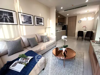 Modern living room with stylish decor and open kitchen layout