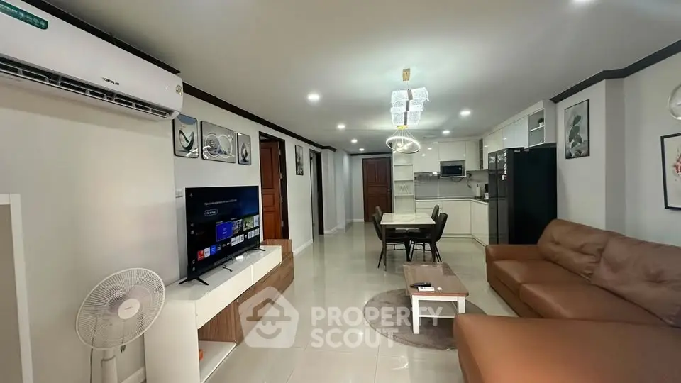 Spacious modern living room with open kitchen and stylish decor