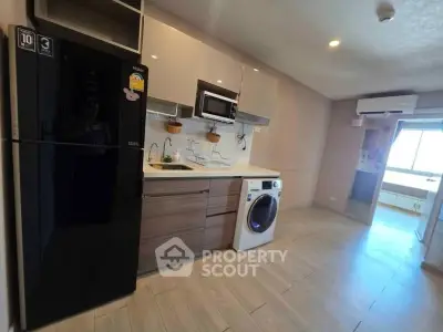 Modern kitchen with sleek appliances and open layout in stylish apartment