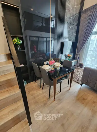 Modern duplex living room with elegant dining area and stylish decor