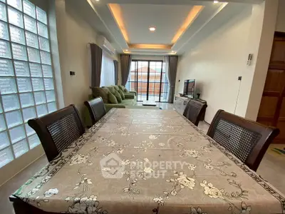 Spacious living room with elegant dining area and modern decor