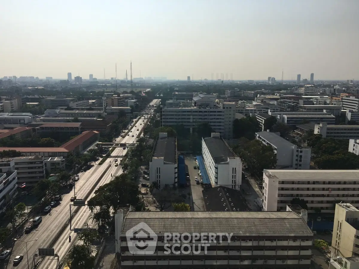 Stunning cityscape view from high-rise building showcasing urban architecture and expansive skyline.