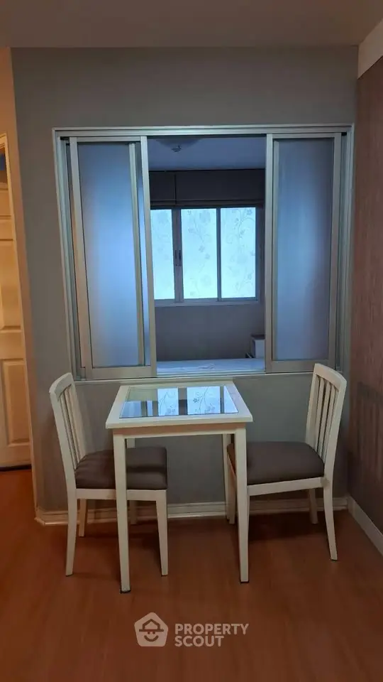 Cozy dining nook with table and chairs in modern apartment interior
