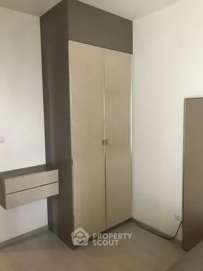 Modern bedroom with sleek built-in wardrobe and minimalist design