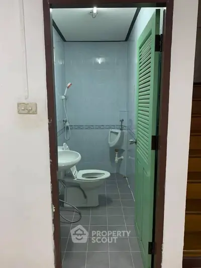 Compact bathroom with shower and toilet in modern home