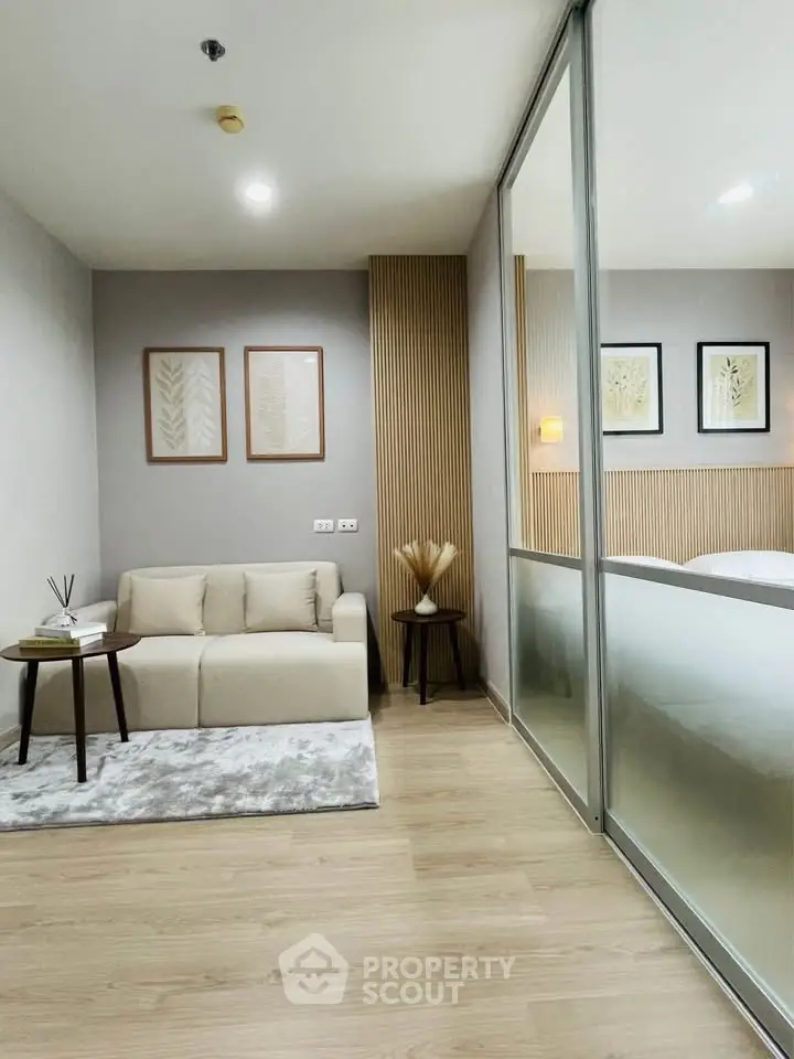Modern living room with cozy sofa and stylish decor in a contemporary apartment.