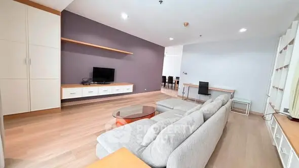 Spacious modern living room with sleek furniture and open layout, perfect for entertaining.