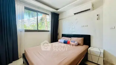 Cozy bedroom with modern decor and air conditioning, featuring a large window with a view of palm trees.