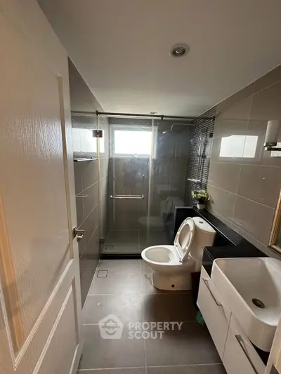 Modern bathroom with sleek design and glass shower enclosure