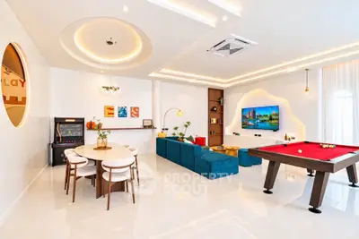 Luxurious modern living room with pool table and stylish decor