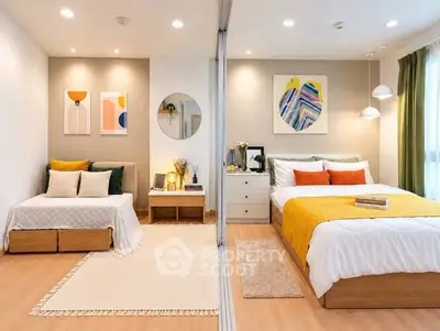Modern bedroom with stylish decor and cozy ambiance, featuring a bed and a daybed separated by a partition.
