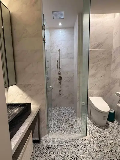 Luxurious modern bathroom with sleek marble tiles and elegant fixtures