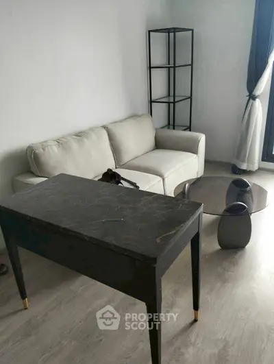 Modern living room with stylish furniture and natural light, perfect for urban living.
