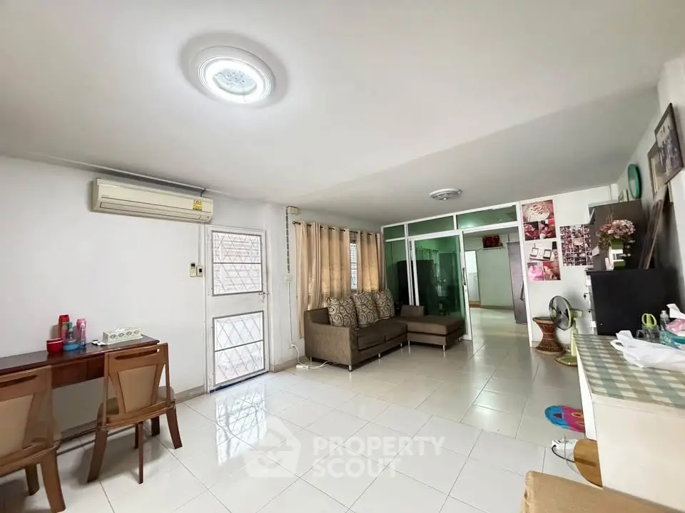Spacious living room with modern decor and ample natural light