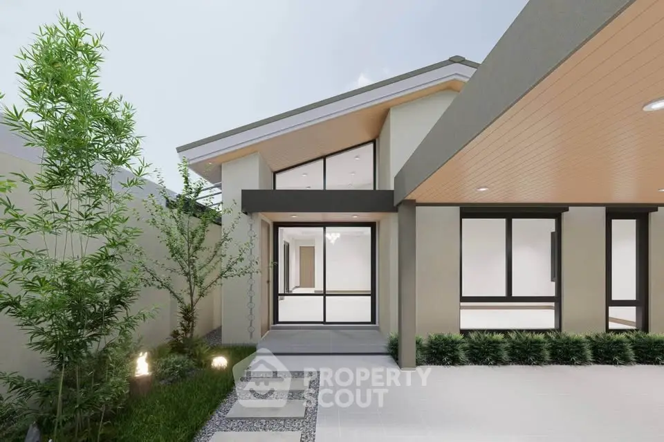 Modern single-story home exterior with sleek design and lush landscaping.