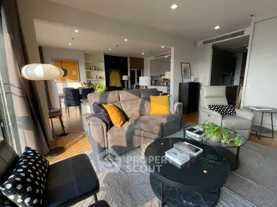 Spacious modern living room with stylish decor and abundant natural light