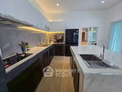 Modern kitchen with sleek countertops and under-cabinet lighting