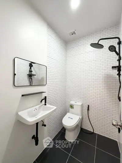 Modern bathroom with sleek fixtures and white subway tiles