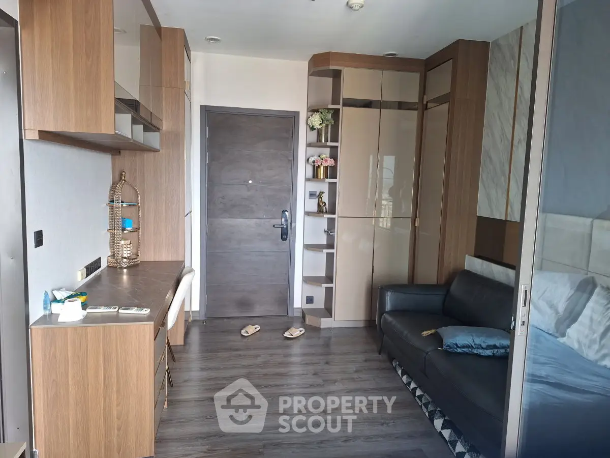 Modern apartment interior with sleek wooden finishes and cozy living area.