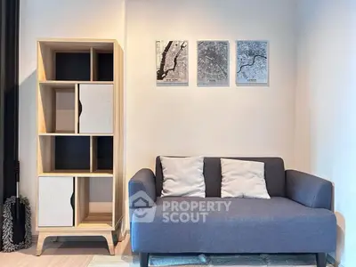Modern living room with stylish sofa and wooden shelving unit