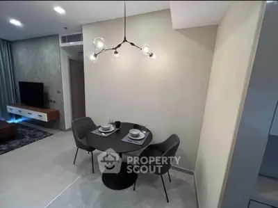 Modern dining area with stylish lighting in a contemporary apartment