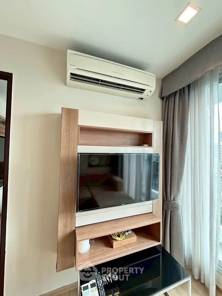 Modern living room with air conditioning and stylish TV setup