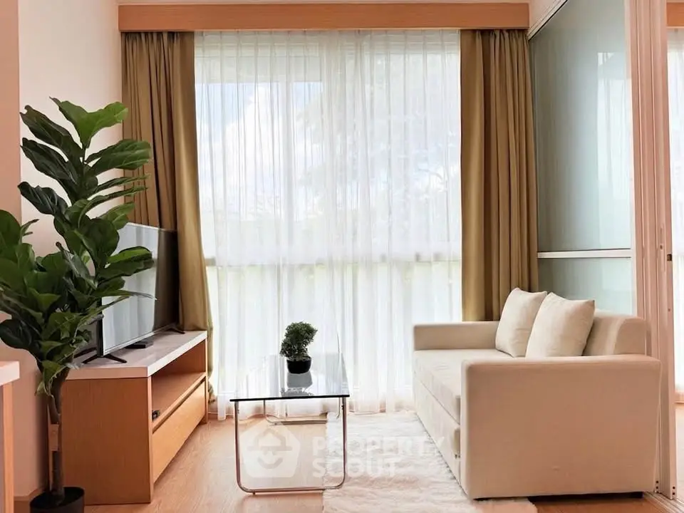 Bright and cozy living room with large window and modern decor