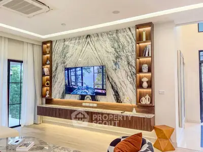 Luxurious living room with marble feature wall and modern decor