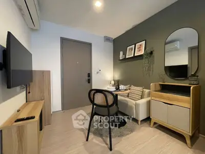Modern living room with stylish decor and compact furniture