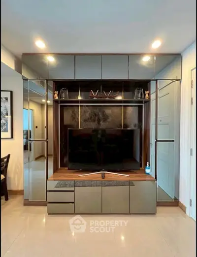 Modern living room with sleek entertainment center and ambient lighting