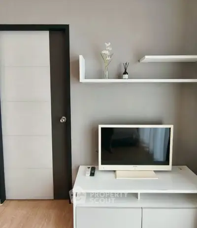 Modern living room with sleek TV setup and minimalist decor