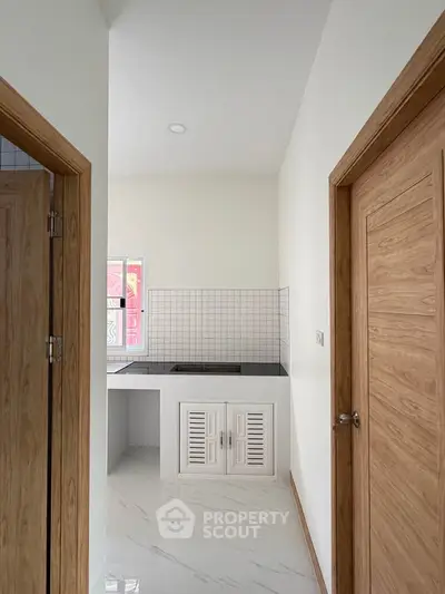 Modern kitchen with sleek design and closed layout