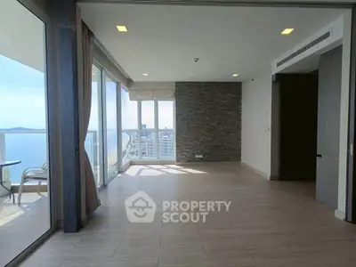 Spacious corner unit with stunning ocean view and large balcony in modern apartment.
