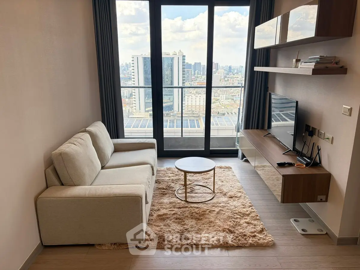 Modern living room with city view, featuring cozy sofa, stylish shelves, and large windows for natural light.