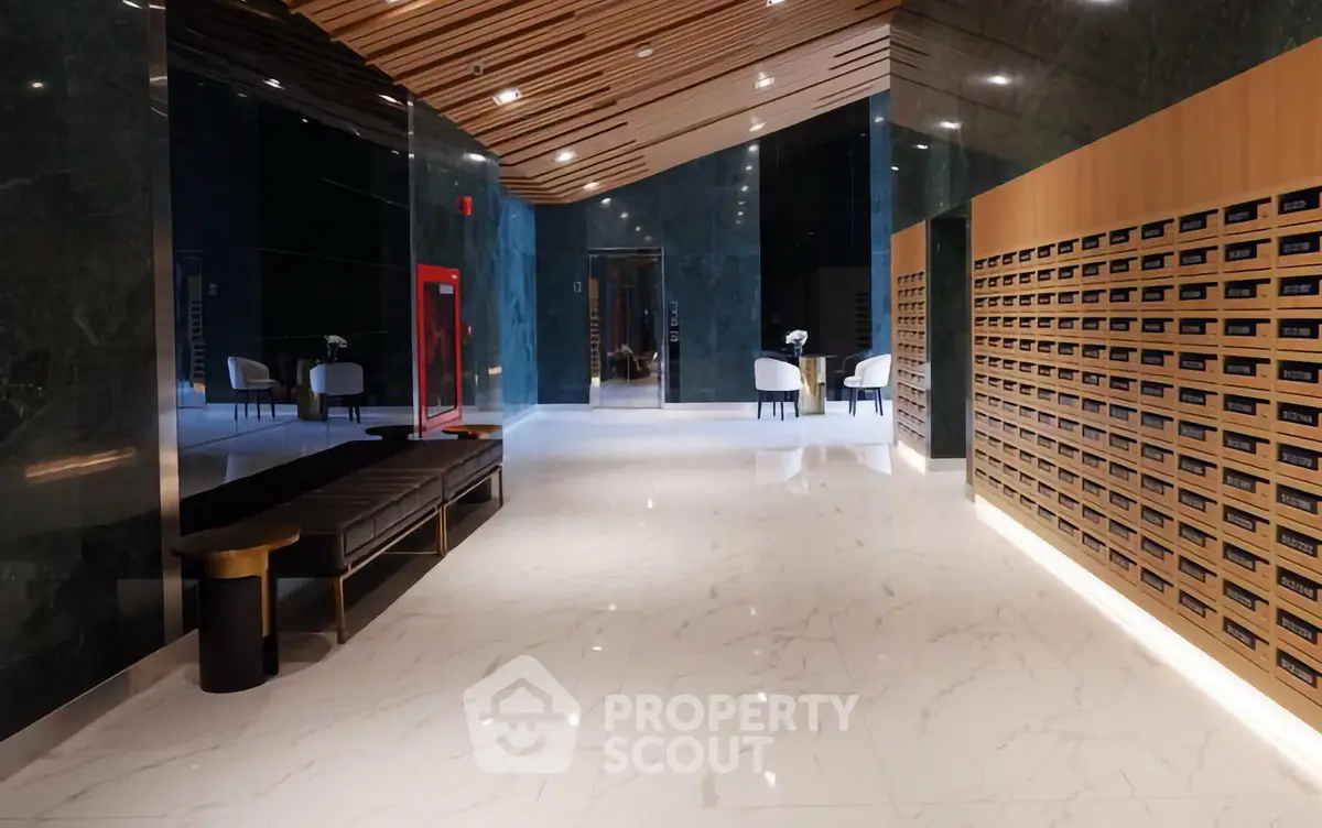 Luxurious modern building entrance with sleek design and elegant seating area