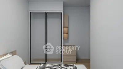 Modern minimalist bedroom with sliding closet doors and wooden furniture.