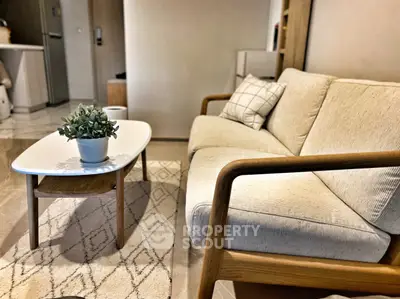 Cozy living room with modern sofa and stylish coffee table, perfect for relaxation.