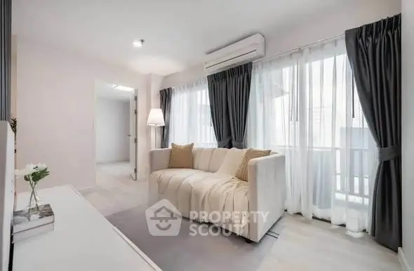 Bright and cozy living room with modern sofa and large windows