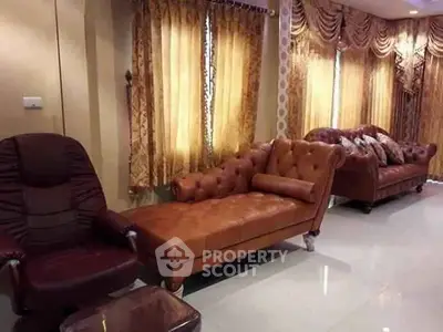 Luxurious living room with elegant leather sofas and stylish curtains