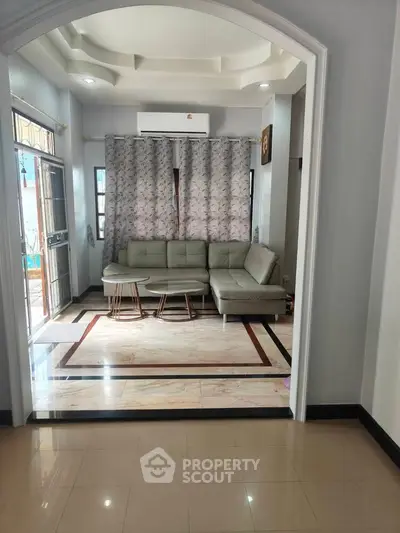 Spacious living room with modern sofa and elegant flooring