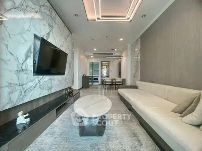 Luxurious modern living room with marble accents and sleek furniture design.