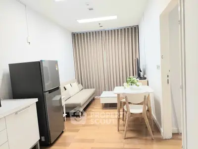 Modern apartment living room with sleek furniture and natural light