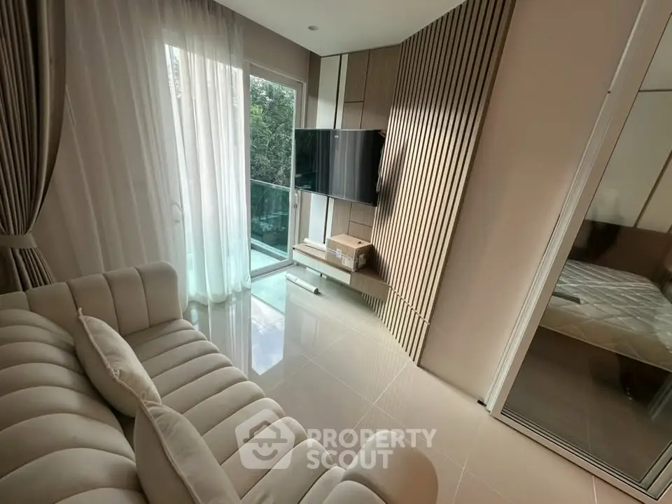 Modern living room with sleek design and balcony access