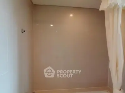 Minimalist bathroom with tiled walls and shower curtain
