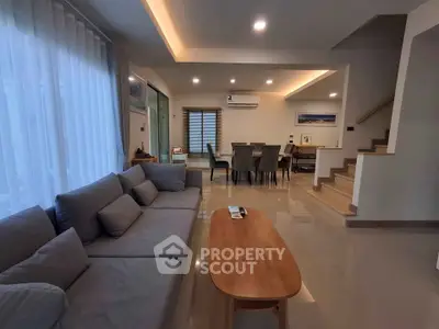 Spacious modern living room with elegant dining area and stylish decor