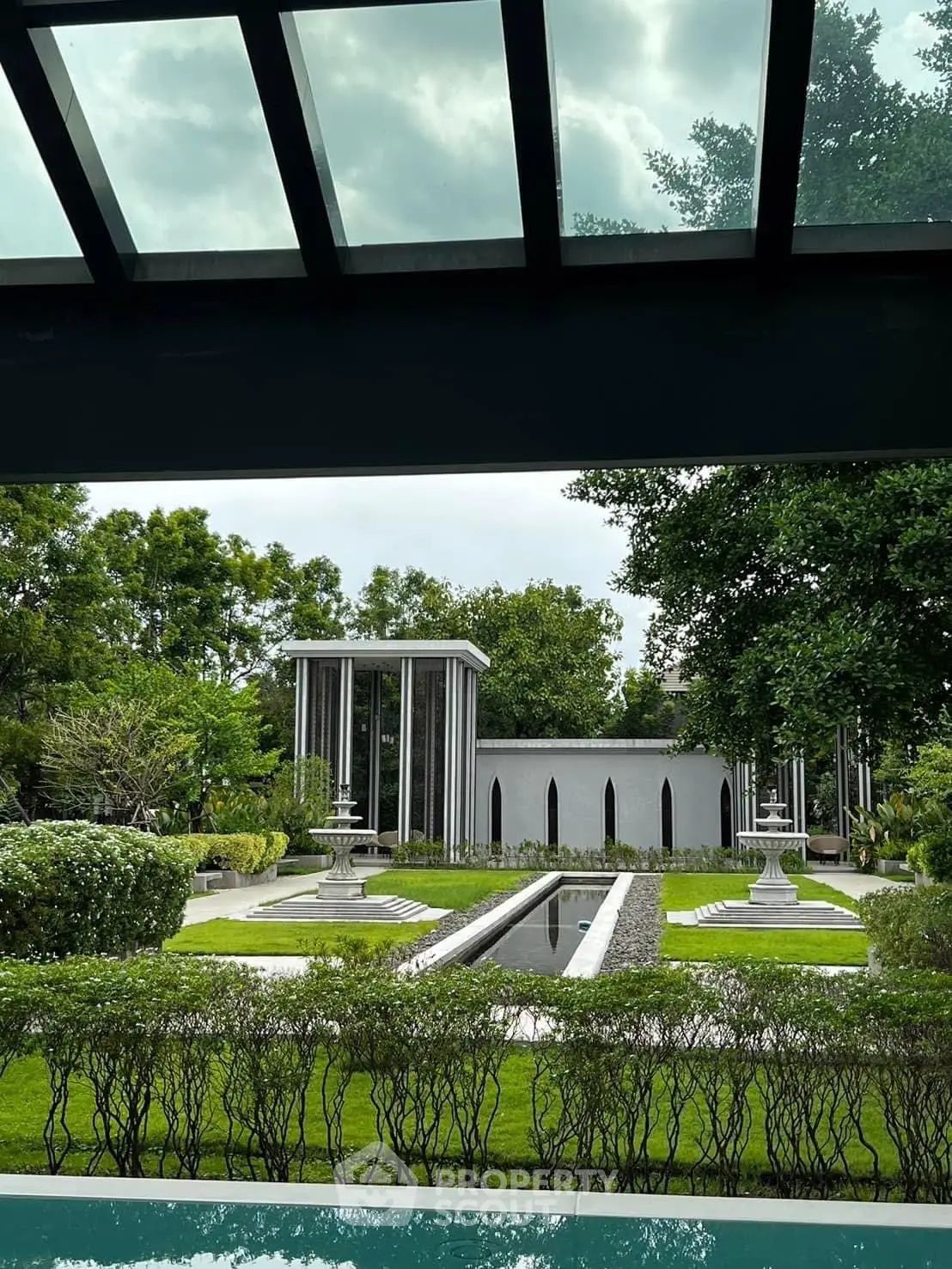 Luxurious garden view with modern architecture and lush greenery