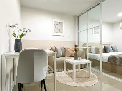 Modern living room with cozy seating and stylish decor in a contemporary apartment.